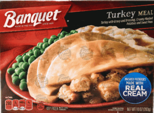 Banquet turkey meal; with gravy and dressing, creamy mashed potatoes and sweet peas 10 ounce